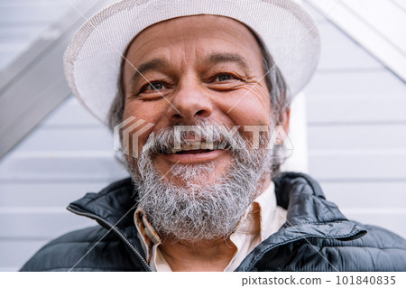 A man standing near his automatic gate, coming home from work, the security and safety of his own home. A man standing near his automatic gate, coming home from work, the security and safety of his own home. 101840835
