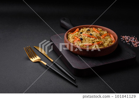 Delicious Uzbek pilaf with chicken, carrots, barberry, spices and herbs Delicious Uzbek pilaf with chicken, carrots, barberry, spices and herbs 101841129