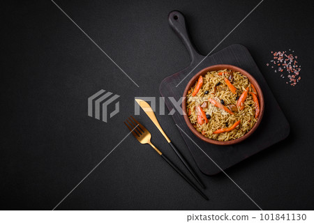 Delicious Uzbek pilaf with chicken, carrots, barberry, spices and herbs Delicious Uzbek pilaf with chicken, carrots, barberry, spices and herbs 101841130