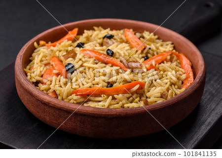 Delicious Uzbek pilaf with chicken, carrots, barberry, spices and herbs 101841135