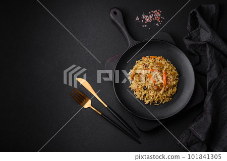 Delicious Uzbek pilaf with chicken, carrots, barberry, spices and herbs Delicious Uzbek pilaf with chicken, carrots, barberry, spices and herbs 101841305