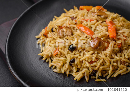 Delicious Uzbek pilaf with chicken, carrots, barberry, spices and herbs Delicious Uzbek pilaf with chicken, carrots, barberry, spices and herbs 101841310
