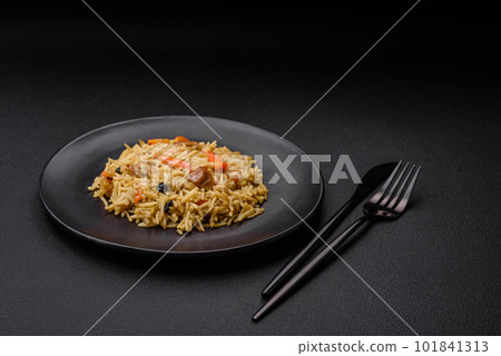 Delicious Uzbek pilaf with chicken, carrots, barberry, spices and herbs Delicious Uzbek pilaf with chicken, carrots, barberry, spices and herbs 101841313