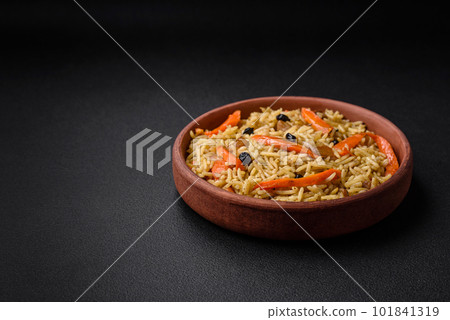 Delicious Uzbek pilaf with chicken, carrots, barberry, spices and herbs Delicious Uzbek pilaf with chicken, carrots, barberry, spices and herbs 101841319