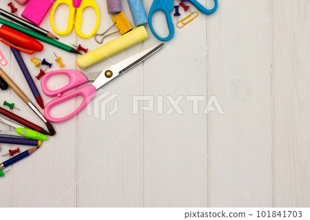 Coloured school supplies on a white wooden background, . Top view. Copyspace. Education and back to school concept. 101841703