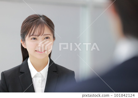 Job hunting _ smiling woman taking interview exam _ close-up 1 Job hunting _ smiling woman taking interview exam _ close-up 1 101842124