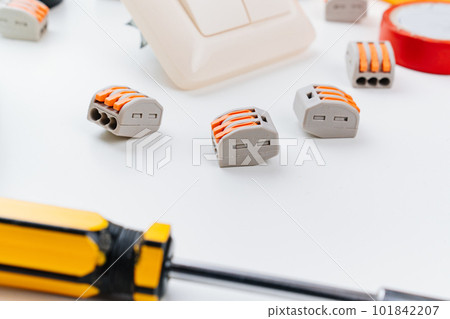 working tools for an electrician on a white background. working tools for an electrician on a white background. 101842207