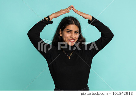 Woman playing catching up game, feeling in safe making roof above head, insurance, security service 101842918