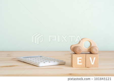 A block written as EV, a calculator and a car toy A block written as EV, a calculator and a car toy 101843121