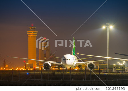 [ANA aircraft Green Jet with control tower glowing in the morning glow from Keihinjima Tsubasa Park] 101843193