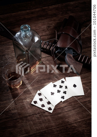 Old west gambling. Dead man's hand. Two-pair poker hand consisting of the black aces and black eights, held by Old West gunfighter Wild Bill Hickok when he was murdered while playing a poker. 101844706