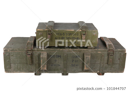 Stack of army ammunition green crates. Text in russian - type of ammunition, projectile caliber, projectile type, number of pieces and weight. 101844707