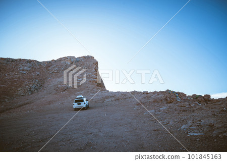 Driving off road car on the high altitude mountain slope 101845163