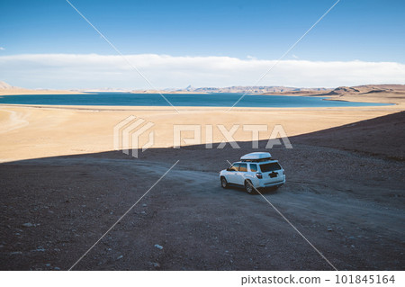 Driving off road car on the high altitude mountain slope 101845164