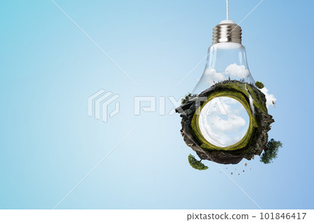 Green landscape inside light bulb Green landscape inside light bulb 101846417
