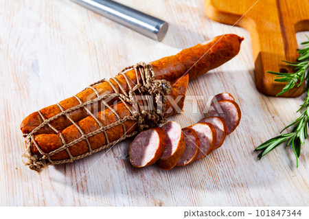 Roasted chezh sausages on cutting board Roasted chezh sausages on cutting board 101847344