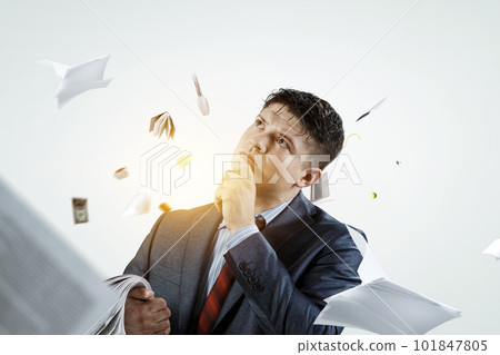 Thoughtful successful businessman dreaming . Mixed media 101847805