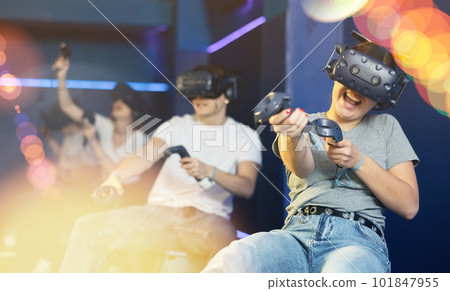 girl in virtual reality glasses controls superhero with joystick in exciting action game simulator girl in virtual reality glasses controls superhero with joystick in exciting action game simulator 101847955
