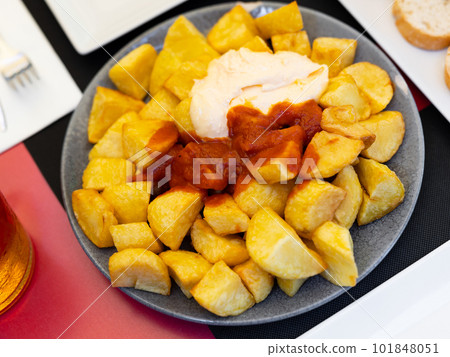 Spanish dish, patatas bravas, served on plate Spanish dish, patatas bravas, served on plate 101848051