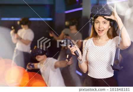 girl is exhilarated by turn of events in VR game and moved virtual reality glasses to forehead 101848181