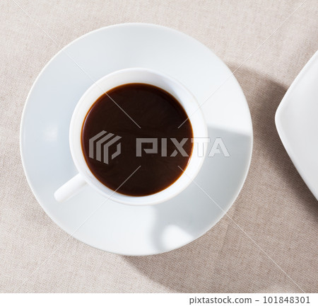 Image of cup of fresh black coffee americano on table Image of cup of fresh black coffee americano on table 101848301