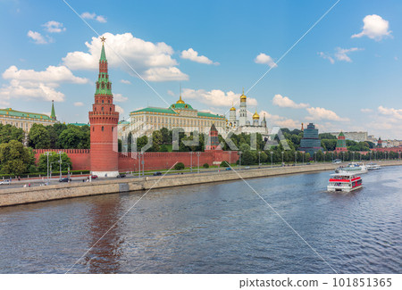 View of Kremlin with Vodovzvodnaya tower, Grand Kremlin Palace from repaired Bolshoy Kamenny Bridgein Moscow city on sunny summer day View of Kremlin with Vodovzvodnaya tower, Grand Kremlin Palace from repaired Bolshoy Kamenny Bridgein Moscow city on sunny summer day 101851365