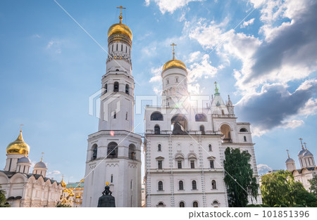 Ivan the Great Bell Tower, with Assumption Belfry on the right in Moscow Kremlin. Blue sky background with sunbeams 101851396