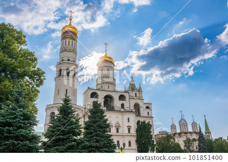 Ivan the Great Bell Tower, with Assumption Belfry on the right in Moscow Kremlin. Blue sky background with sunbeams 101851400