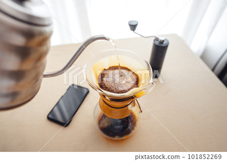 Pouring a hot water over a drip coffee 101852269