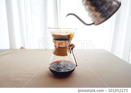 Pouring a hot water over a drip coffee 101852273