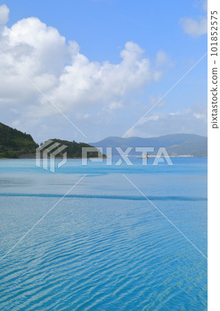 The seascape of Kakeroma Island looks like it has been sprinkled with turquoise blue paint The seascape of Kakeroma Island looks like it has been sprinkled with turquoise blue paint 101852575