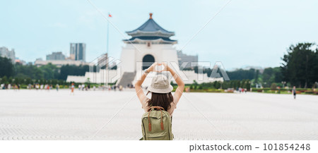 woman traveler visiting in Taiwan, Tourist with backpack sightseeing in National Chiang Kai shek Memorial or Hall Freedom Square, Taipei City. landmark and popular attractions. Asia Travel concept woman traveler visiting in Taiwan, Tourist with backpack sightseeing in National Chiang Kai shek Memorial or Hall Freedom Square, Taipei City. landmark and popular attractions. Asia Travel concept 101854248