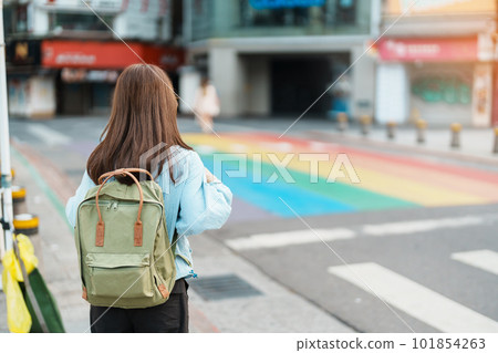 woman traveler visiting in Taiwan, Tourist sightseeing at rainbow crosswalk in ximending, Taipei City. landmark and popular attractions. Asia Travel, Trip and Vacation concept woman traveler visiting in Taiwan, Tourist sightseeing at rainbow crosswalk in ximending, Taipei City. landmark and popular attractions. Asia Travel, Trip and Vacation concept 101854263