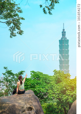 woman traveler visiting in Taiwan, Tourist looking Taipei City during sightseeing and hiking at Elephant Mountain or Xiangshan, landmark and popular attractions. Asia Travel, vacation and Trip concept woman traveler visiting in Taiwan, Tourist looking Taipei City during sightseeing and hiking at Elephant Mountain or Xiangshan, landmark and popular attractions. Asia Travel, vacation and Trip concept 101854272