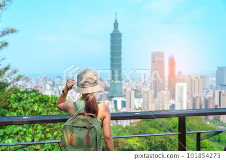 woman traveler visiting in Taiwan, Tourist looking Taipei City during sightseeing and hiking at Elephant Mountain or Xiangshan, landmark and popular attractions. Asia Travel, vacation and Trip concept woman traveler visiting in Taiwan, Tourist looking Taipei City during sightseeing and hiking at Elephant Mountain or Xiangshan, landmark and popular attractions. Asia Travel, vacation and Trip concept 101854273