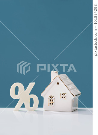 Percentage and house on white desk. mortgage calculator or real estate business concept. Listing. Down payment. Loan or insurance rate payments. Liability and risk 101854298