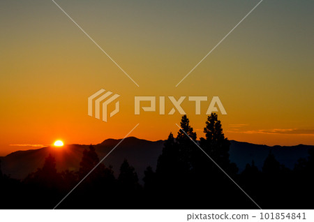 sunset over mountains 101854841