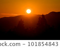 sunset over mountains 101854843