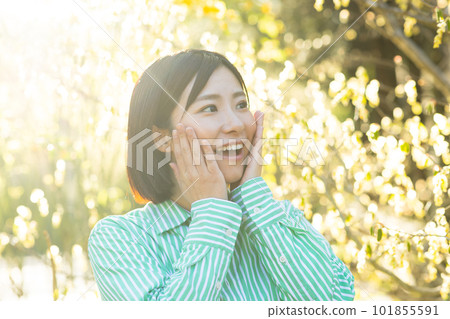 A woman basking in the morning sun 101855591