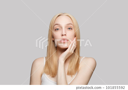 Healthy model woman with long blonde hair and clear fresh skin. Facial treatment, skincare Healthy model woman with long blonde hair and clear fresh skin. Facial treatment, skincare 101855592