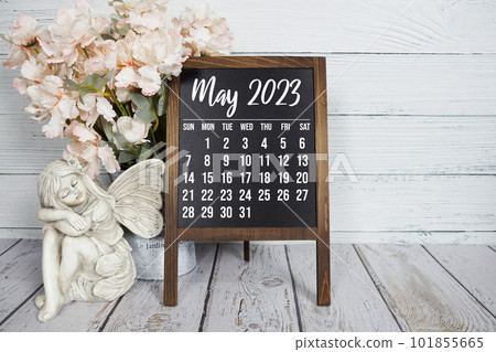 May 2023 monthly calendar on easel stand on wooden background May 2023 monthly calendar on easel stand on wooden background 101855665