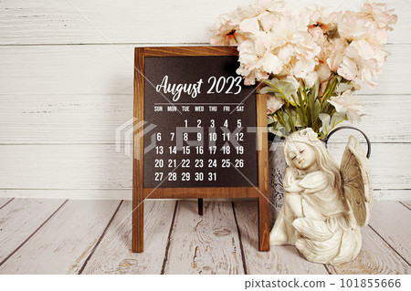 August 2023 monthly calendar on easel stand on wooden background 101855666