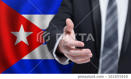 Cuba politics, cooperation and travel concept. Hand on Cuban flag background. 101855910