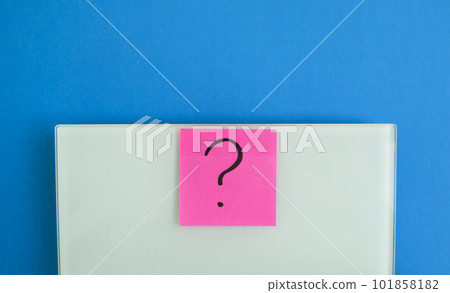 Electronic scales and a sticker with a question mark Electronic scales and a sticker with a question mark 101858182