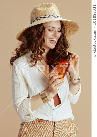 smiling woman in blouse and shorts isolated on beige smiling woman in blouse and shorts isolated on beige 101858331