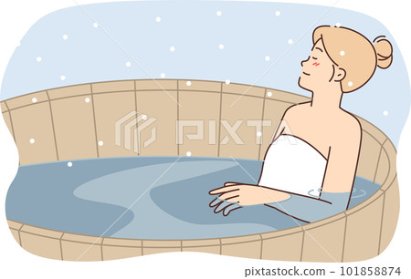 Woman relaxes in wooden finnish sauna pool with hot water enjoying warm outdoor spa 101858874