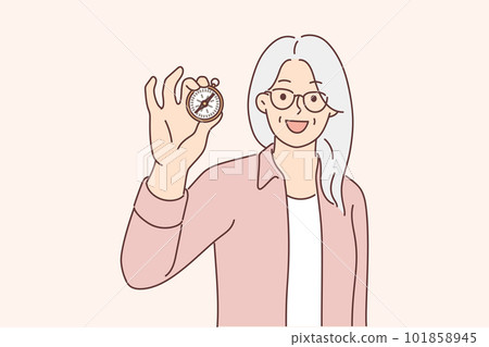 Elderly woman with compass in hand demonstrates navigation device, offers to go on trip 101858945