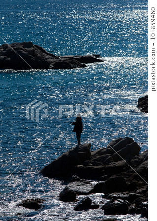 Silhouette of man fishing on mediterranean sea, in Costa Brava of Spain, at sunset. Silhouette of man fishing on mediterranean sea, in Costa Brava of Spain, at sunset. 101859460
