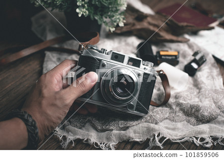 vintage camera in photographer's hand vintage camera in photographer's hand 101859506