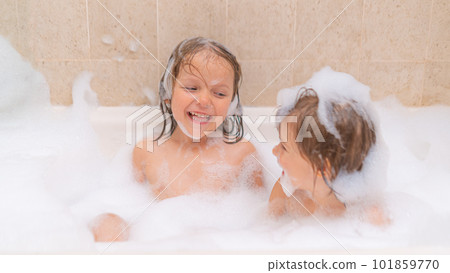 Cute sisters girls in bath with Soap Foam Cute sisters girls in bath with Soap Foam 101859770